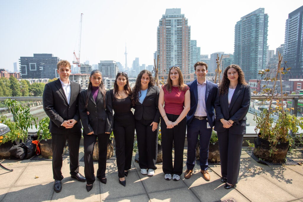 Group of interns Infront of Toronto cityscape