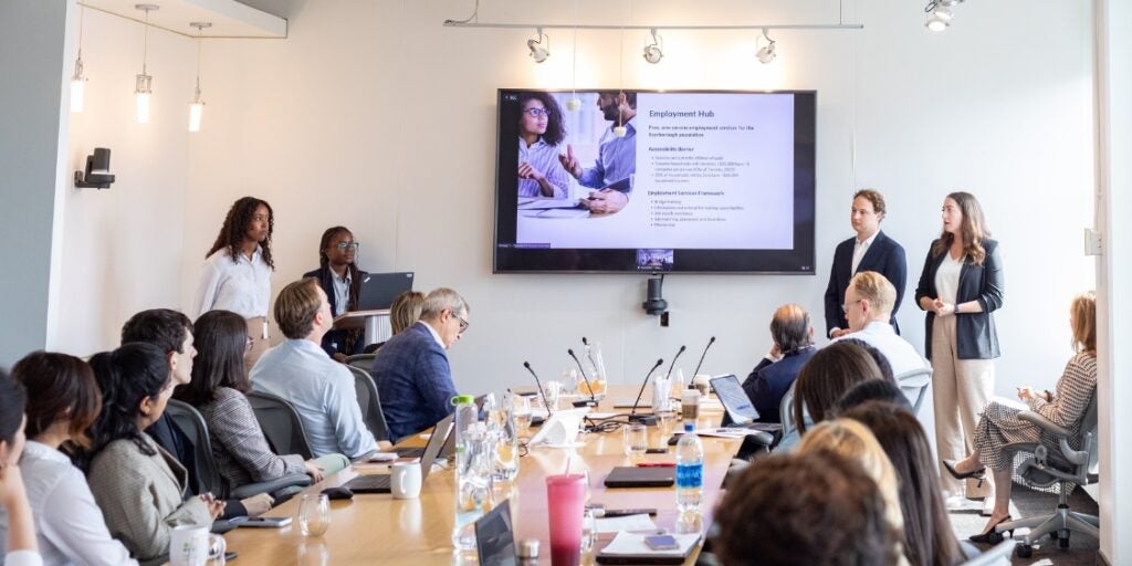 people presenting in boardroom