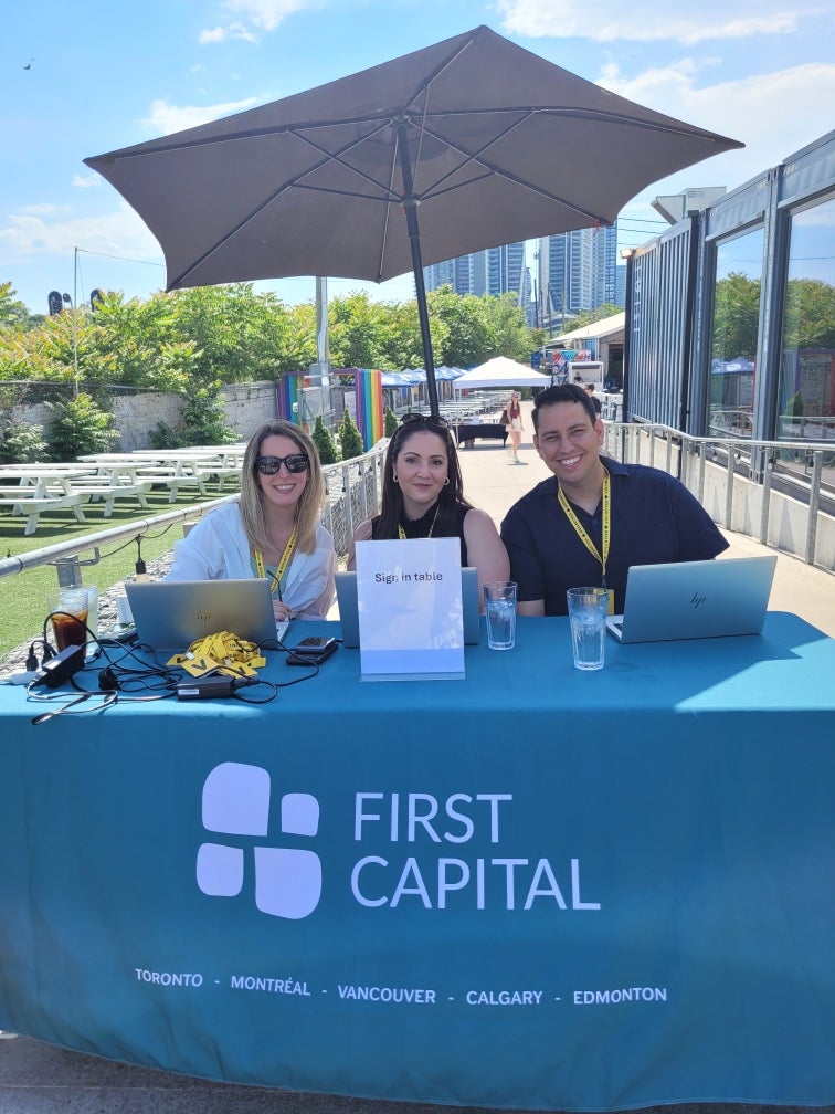 three people at registration table