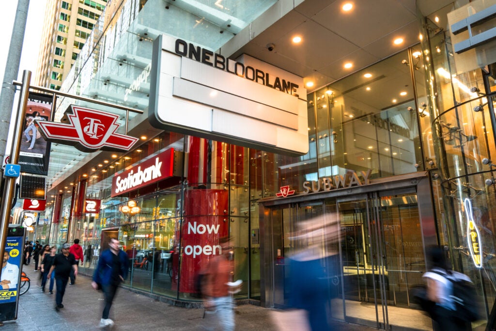 people walking by TTC entrance at One Bloor East 